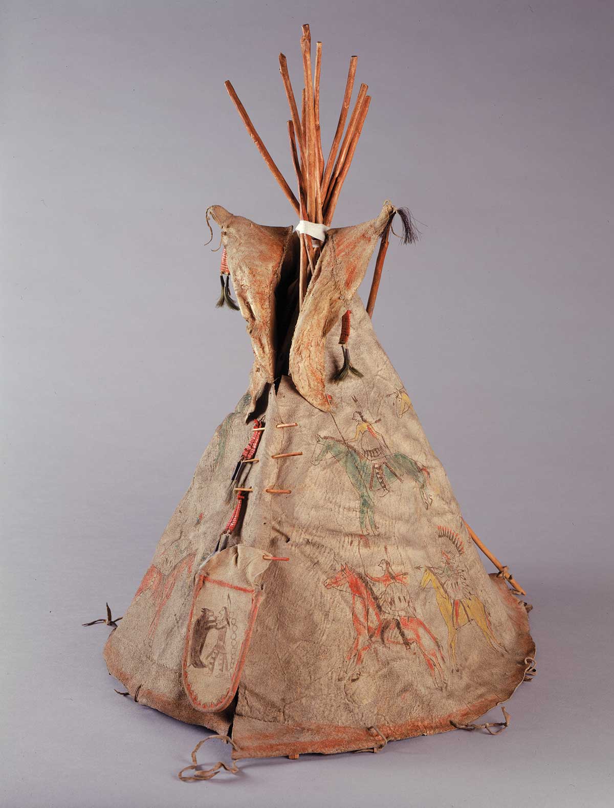 Photo of a painted model tipi made of hide and wood