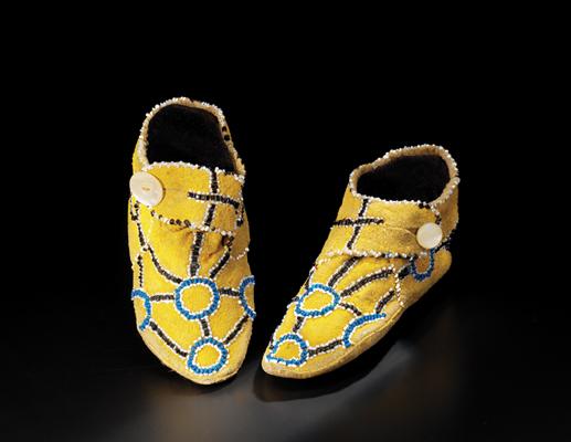Deer hide, ochre, beads, mother-of-pearl buttons.