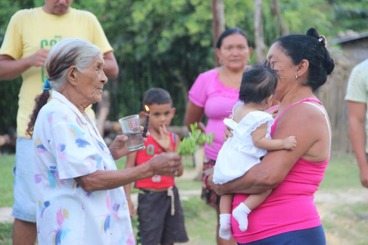 Granma Luisa conducts a baptism and “welcome”