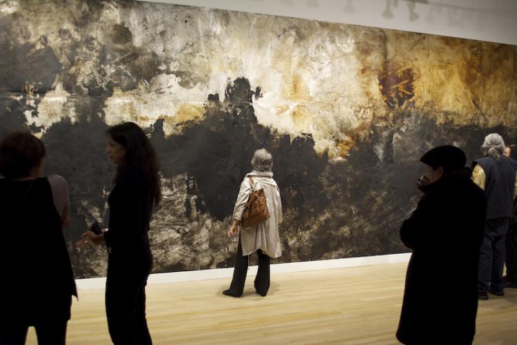 Woman staring at art in LaTocha Installation