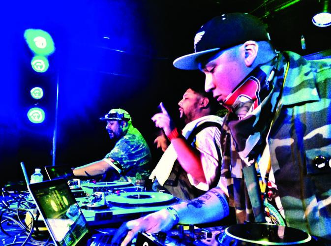 A Tribe Called Red during a live show.