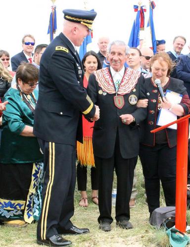Shay being congratulated by Major General