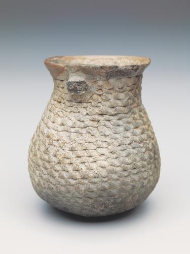 jar resembling a basket, not quite 4 inches tall