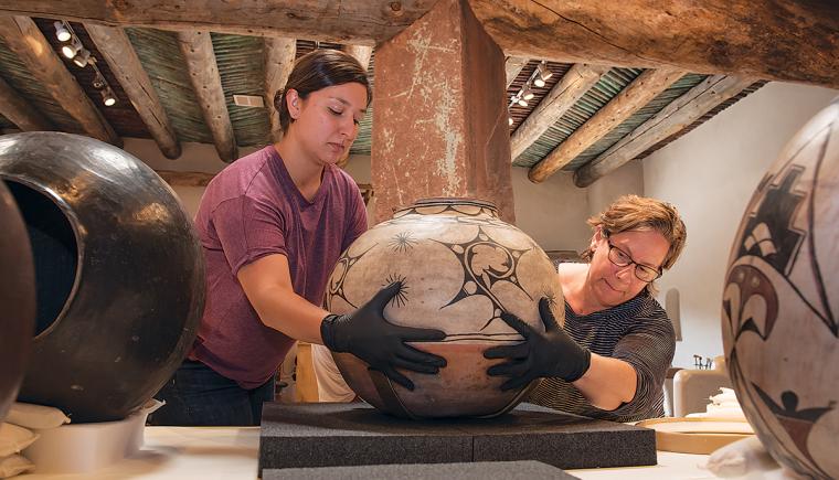 Tazbah Gaussoin and Shelly Uhlir carefully positioning pots