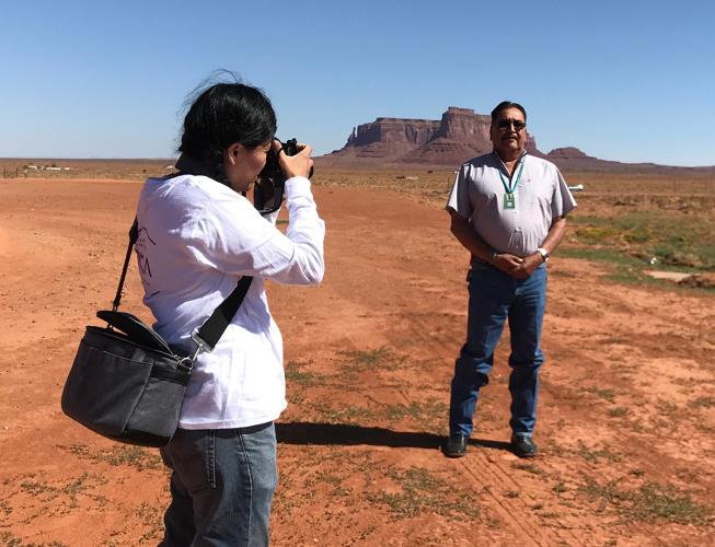 High Country News reporter Jolene Yazzie (Diné) photographs Utah Navajo Health System board member Wilfred Jones