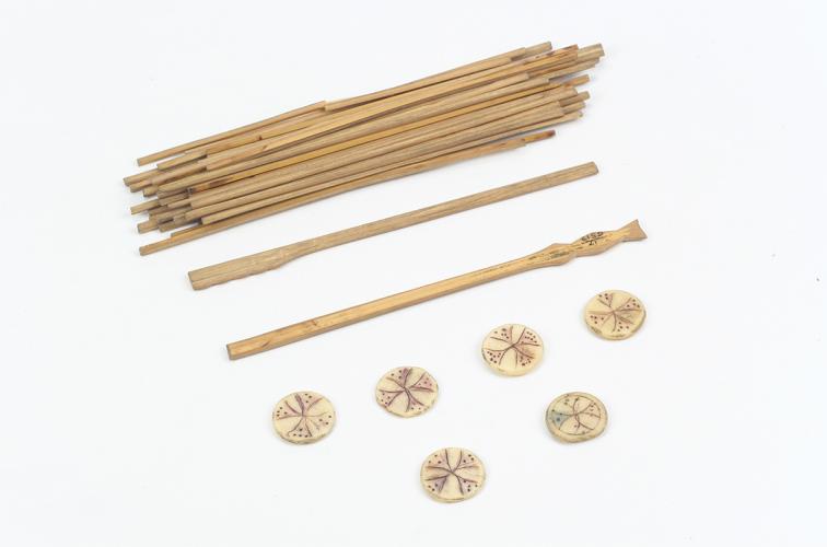 Wooden sticks and bone dice from the game waltes