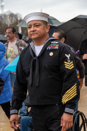 A man in a Navy uniform decorated with medals