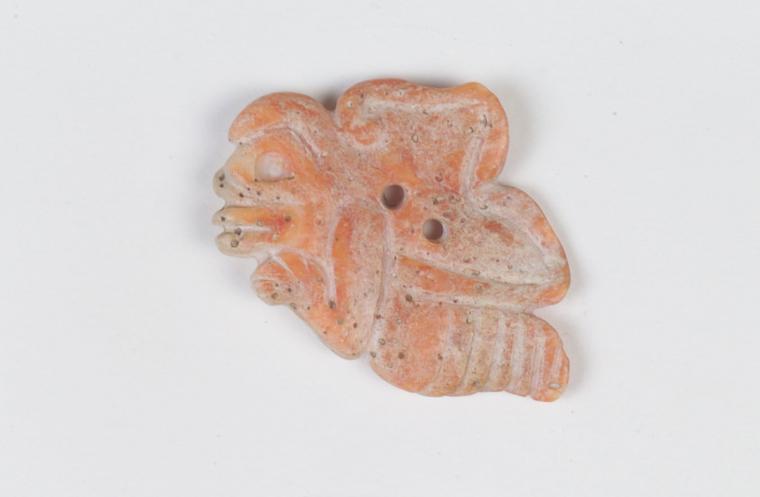 A light pink carved pendant