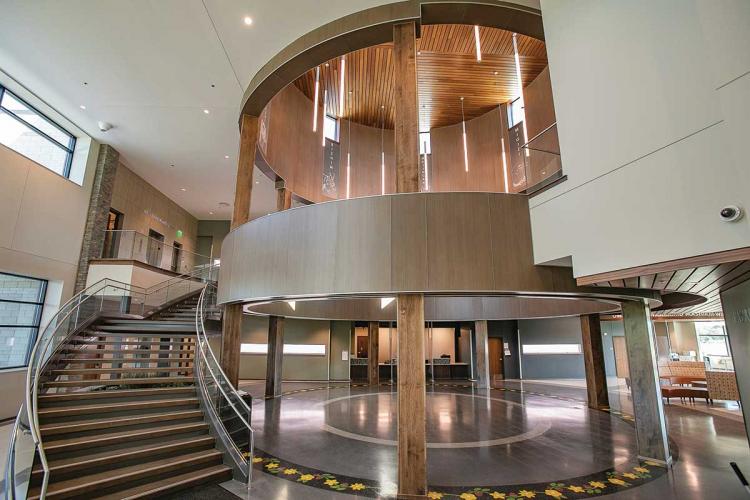 The interior of a building with a curving staircase