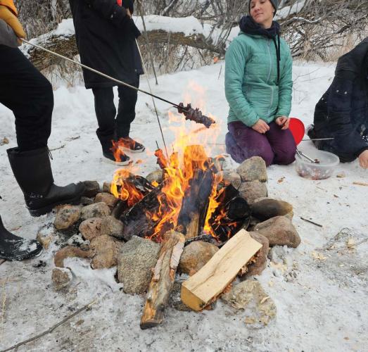 Youth gathered around a fire.