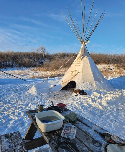 A tipi in the snow.