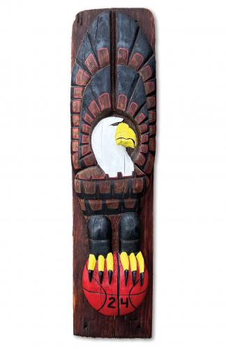 Restored wooden totem pole.