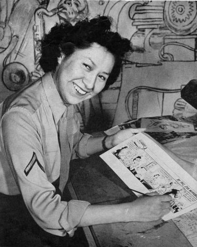 Eva Mirabel draws her comic strip at her desk.