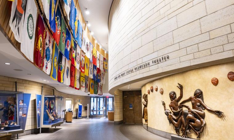 A display of many tribal nations' flags outside of the Elmer and Mary Louise Rasmuson Theatre at the National Museum of the American Indian in Washington, D.C.