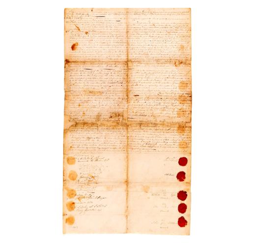 The Treaty of Delaware, browned with age but well preserved, contains the handwritten treaty, signatures, and red wax stamps.