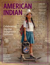 Magazine cover featuring a photograph of a Bolivian skateboarder wearing a skirt and bowler hat